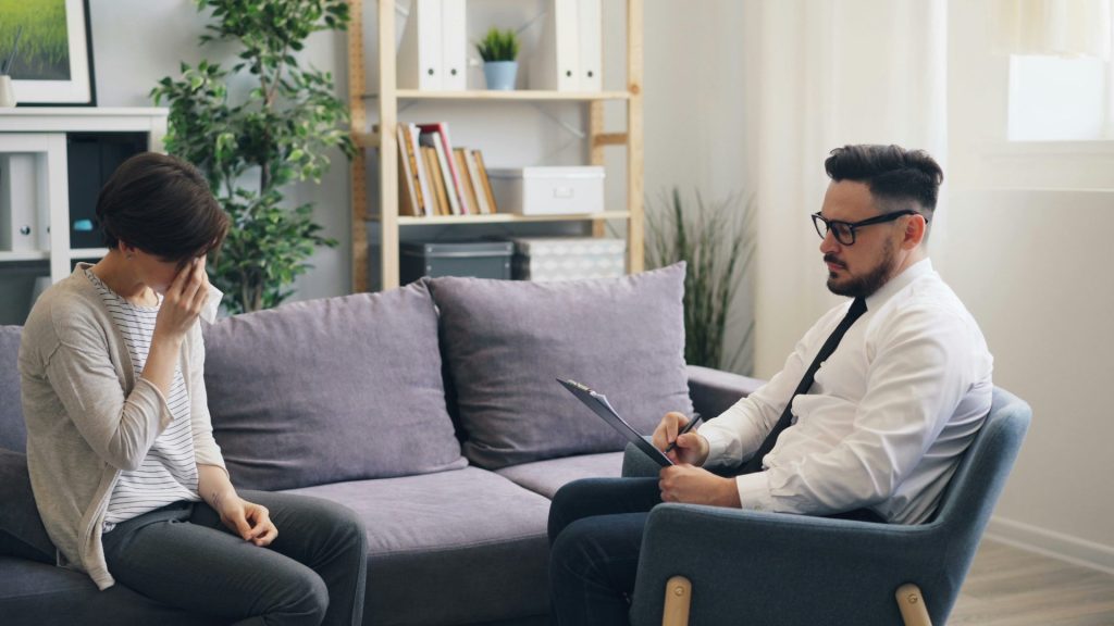 a man and a woman sitting on a couch
